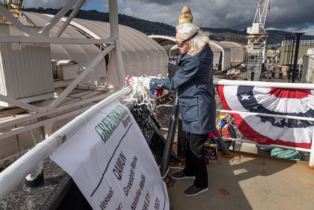 Natalie Meidel,sponsor, carries about the ceremony to christen Qamun for Crowley Fuels and Greenbrier.