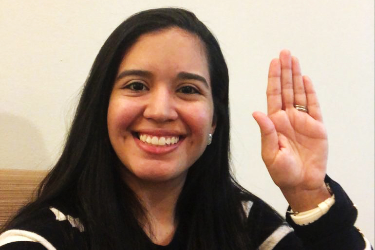 woman raising hand 