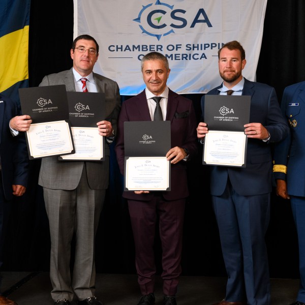 Crowley maritime safety awards presentation with Chamber of Shipping of America Devlin Safety Award recipients holding certificates on stage