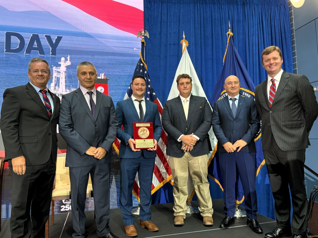 Stena Immaculate crew members, along with union and Crowley leadership, standing side by side with Gallant Ship Award plaque.